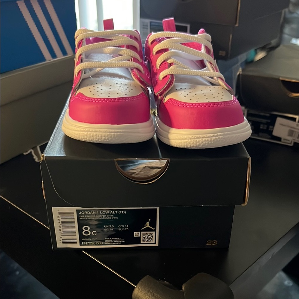 Jordan 1 Low fire pink and white